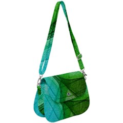 Sunlight Filtering Through Transparent Leaves Green Blue Saddle Handbag by Ket1n9